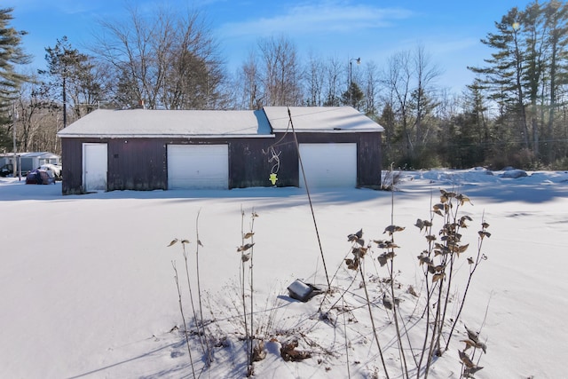 view of snow covered garage