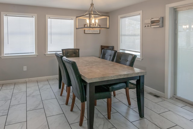 dining area featuring a chandelier