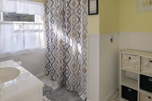 bathroom with vanity and a wealth of natural light