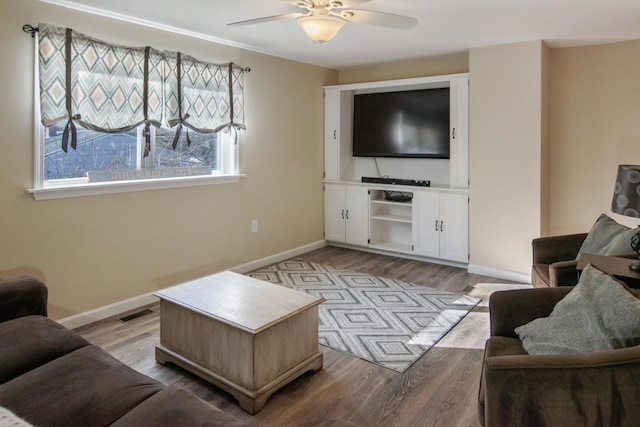 living room with ceiling fan and light wood-type flooring