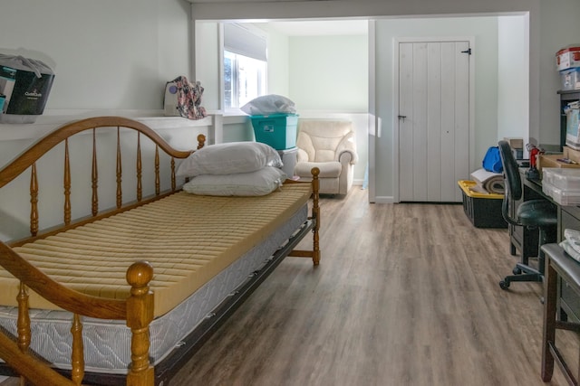 bedroom with hardwood / wood-style flooring