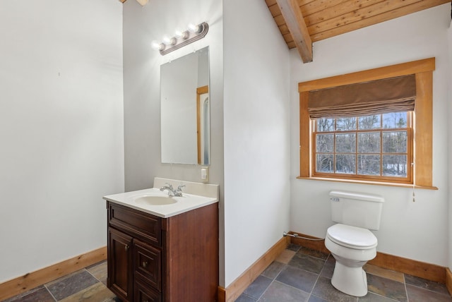 bathroom featuring wood ceiling, vanity, toilet, and beam ceiling