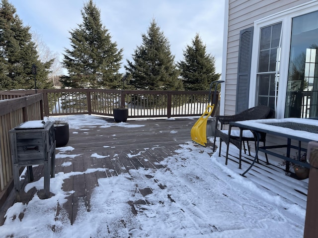 view of snow covered deck