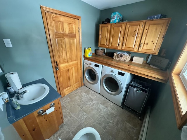 laundry area with cabinets, sink, and independent washer and dryer