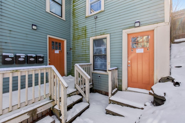 view of snow covered property entrance