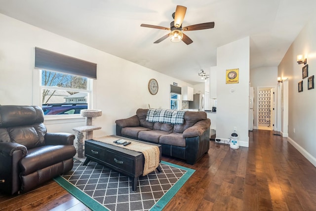 living room with lofted ceiling, dark hardwood / wood-style floors, and ceiling fan