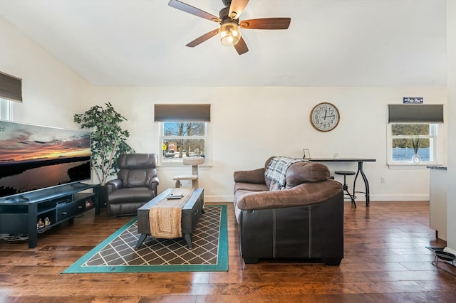 living room featuring plenty of natural light, dark hardwood / wood-style floors, and ceiling fan