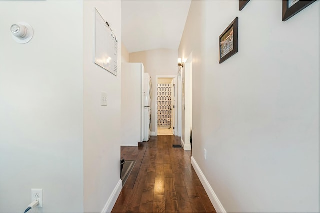 hallway featuring dark wood-type flooring