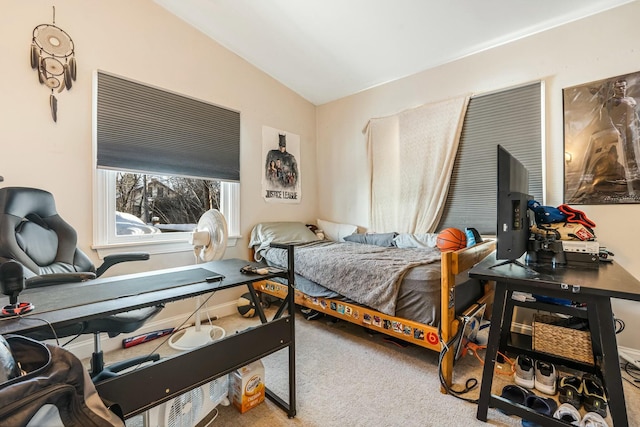 bedroom with lofted ceiling and carpet flooring