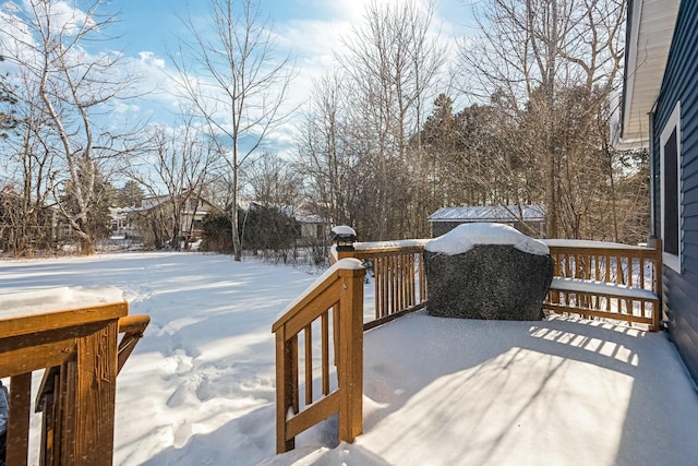 view of snow covered deck