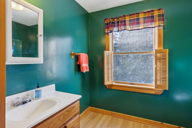 bathroom with vanity and hardwood / wood-style floors