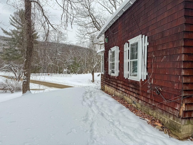 view of snow covered property