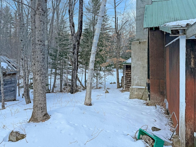 view of yard layered in snow