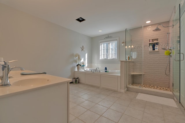 bathroom with recessed lighting, tile patterned floors, a shower stall, a bath, and vanity