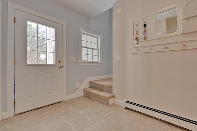 interior space with light tile patterned floors, baseboards, and a baseboard radiator
