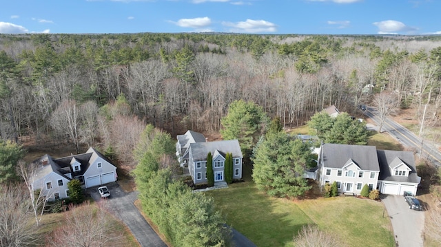 drone / aerial view featuring a view of trees