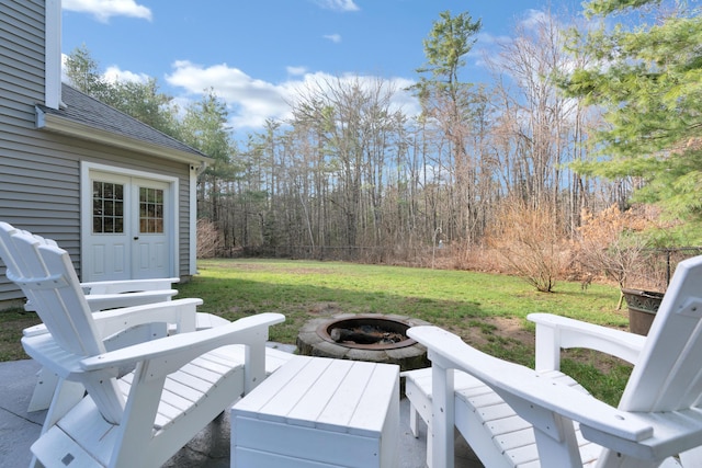 view of patio / terrace featuring an outdoor fire pit
