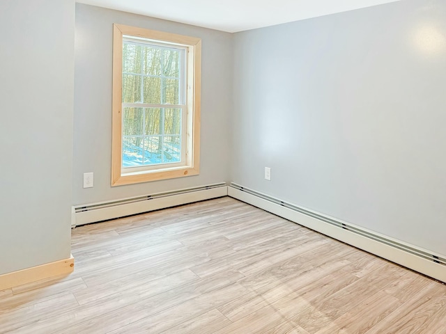 21 Coolidge Rd, Dixfield, ME 04224 - spare room with light wood-style floors, baseboards, and a baseboard radiator