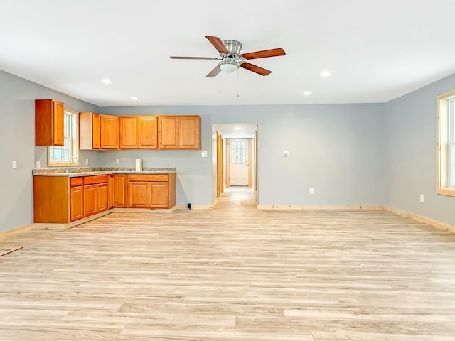 21 Coolidge Rd, Dixfield, ME 04224 - kitchen with light wood-style floors, baseboards, and a wealth of natural light