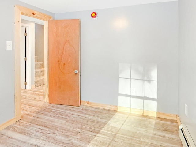 21 Coolidge Rd, Dixfield, ME 04224 - unfurnished room with stairway, baseboard heating, and wood finished floors
