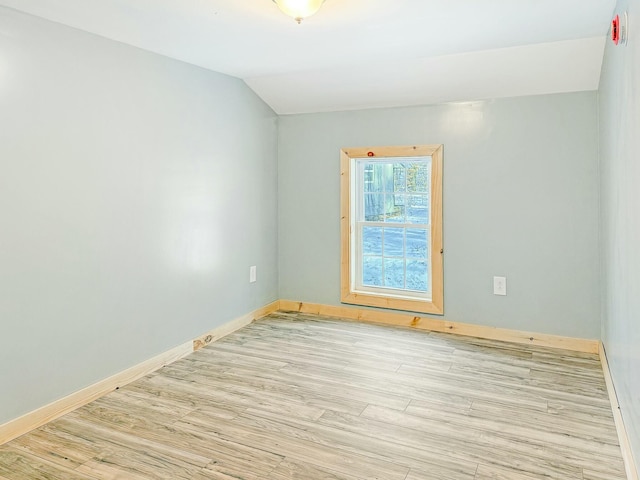 21 Coolidge Rd, Dixfield, ME 04224 - spare room with baseboards, vaulted ceiling, and wood finished floors