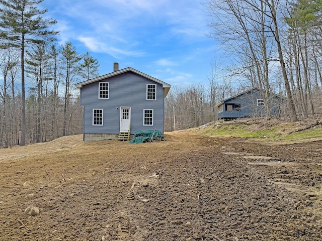 21 Coolidge Rd, Dixfield, ME 04224 - exterior space featuring a chimney and entry steps