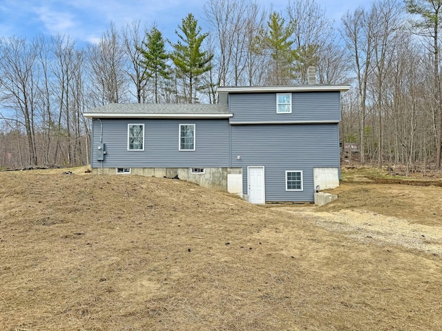 21 Coolidge Rd, Dixfield, ME 04224 - back of property with a chimney