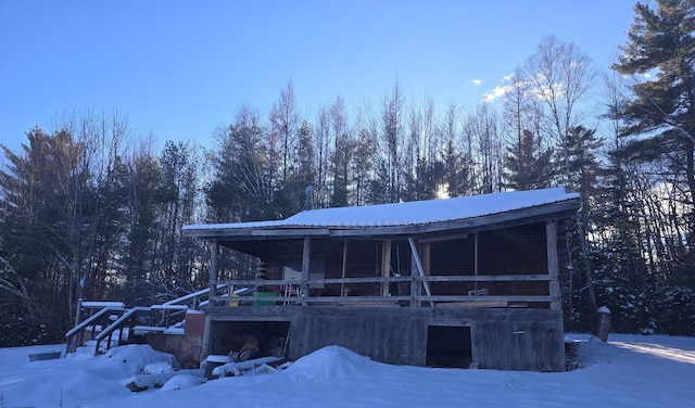 view of front of property with a garage and metal roof