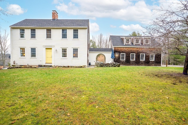 colonial-style house with a front yard