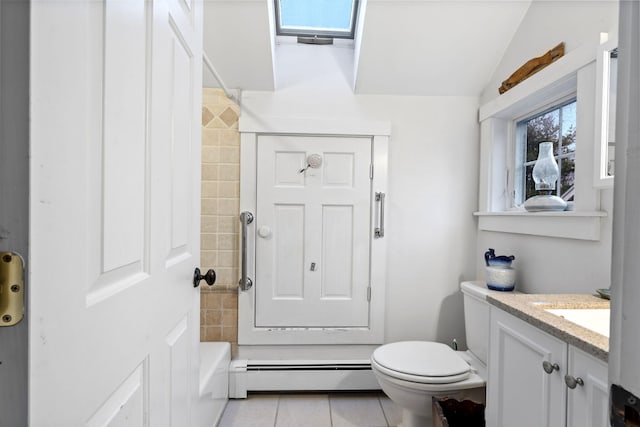 bathroom featuring lofted ceiling, tile patterned flooring, vanity, a baseboard heating unit, and toilet