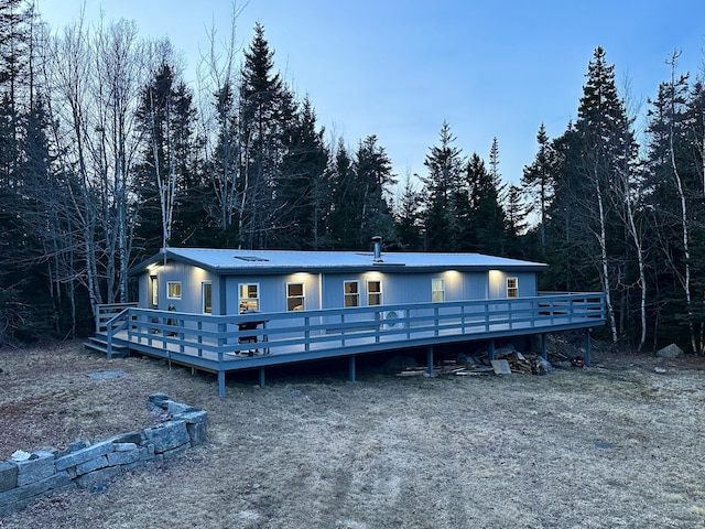 view of front of house with a wooden deck