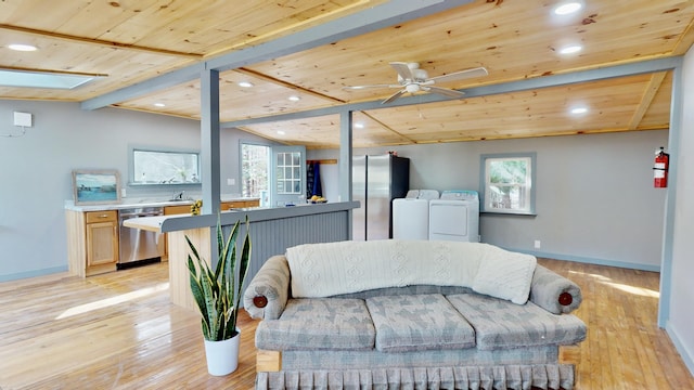 living room featuring wood ceiling, separate washer and dryer, lofted ceiling with beams, ceiling fan, and light hardwood / wood-style floors