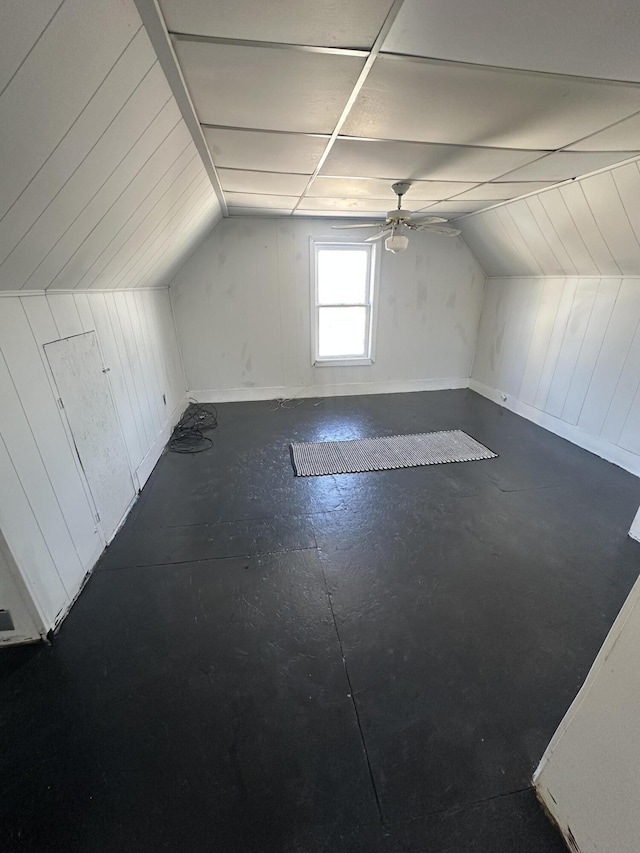 bonus room with a ceiling fan and lofted ceiling