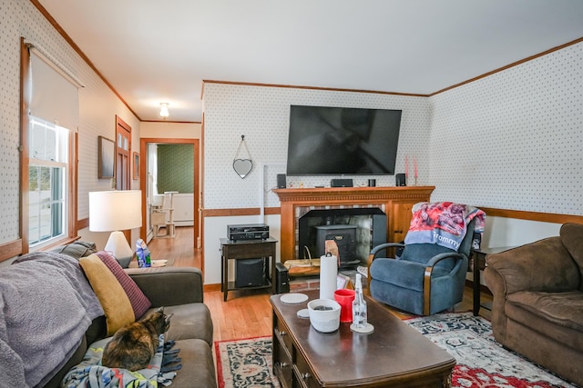 living room featuring crown molding and hardwood / wood-style floors