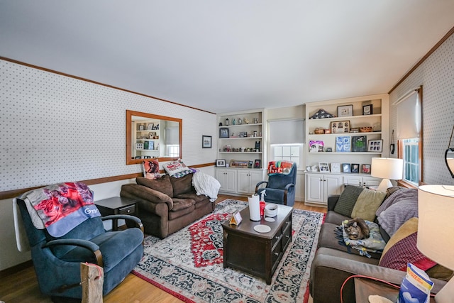 living room featuring crown molding and wood-type flooring