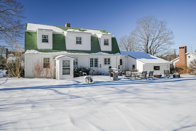 view of snow covered house