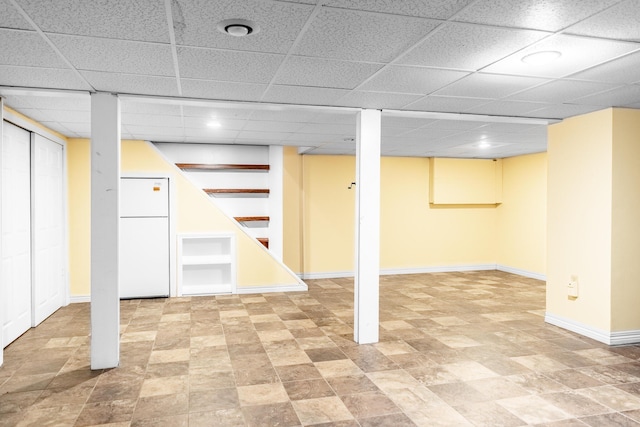 basement with white fridge