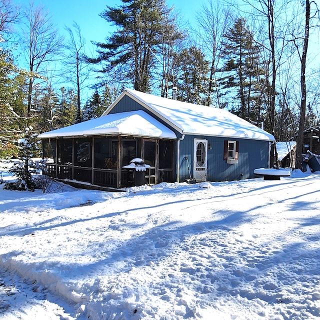 exterior space featuring a sunroom