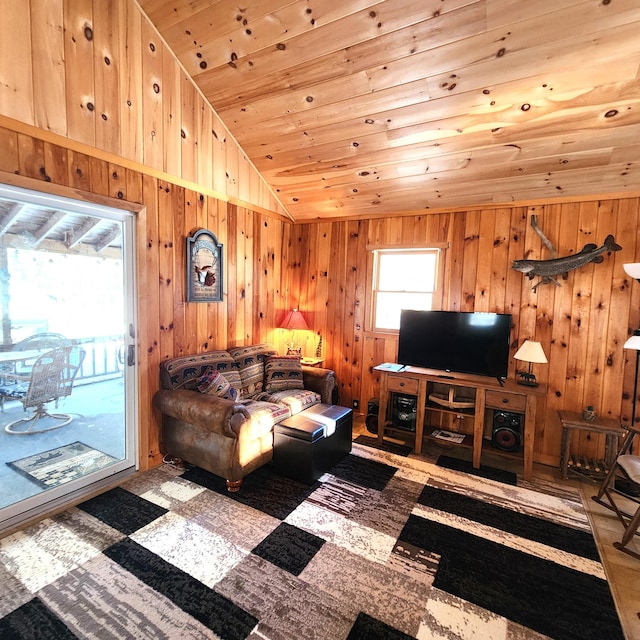 living room with vaulted ceiling, wooden ceiling, and wooden walls