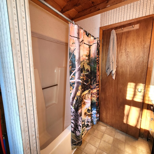 bathroom with shower / tub combo with curtain