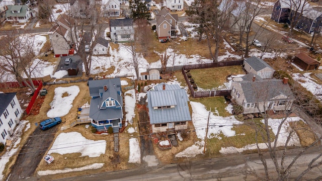 snowy aerial view featuring a residential view