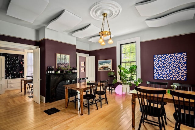 dining space with light hardwood / wood-style flooring