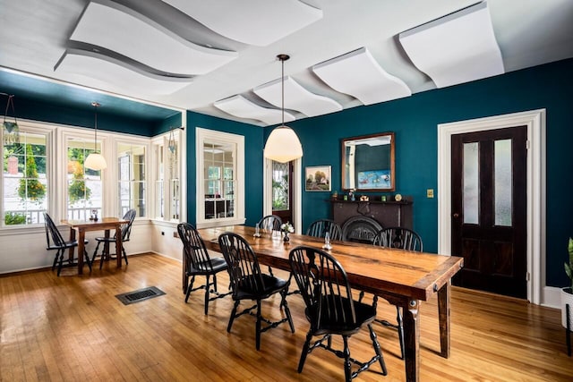 dining area with wood-type flooring