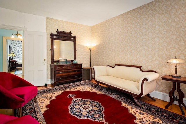 living area with hardwood / wood-style flooring
