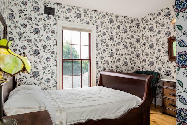 bedroom featuring light hardwood / wood-style floors