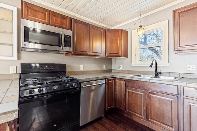 kitchen featuring sink, tile counters, stainless steel appliances, and wooden ceiling