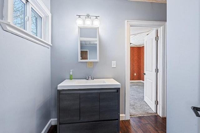 bathroom featuring hardwood / wood-style flooring and vanity