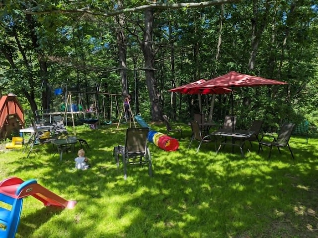 view of playground featuring a lawn