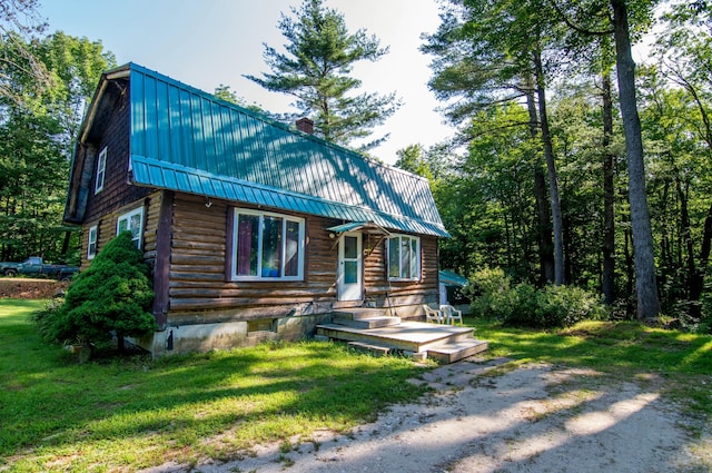 log home with a front lawn