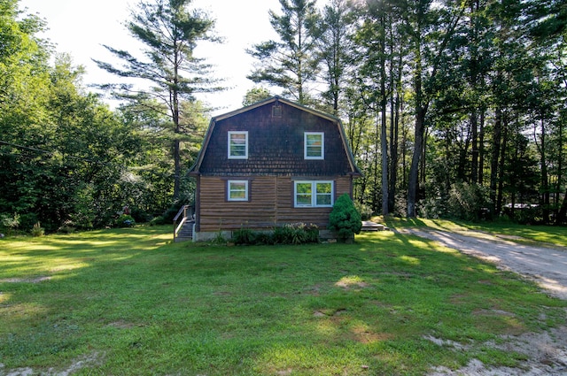 view of property exterior featuring a lawn